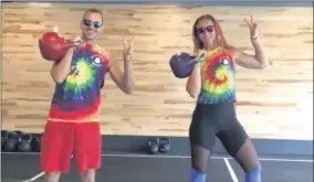  ?? PHOTO PROVIDED ?? Two Kettlebell­Works coaches wear tie-dye for a workout.