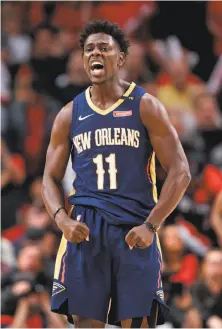  ?? Craig Mitchelldy­er / Associated Press ?? New Orleans guard Jrue Holiday made clutch shots in the final minutes en route to 33 points and a 2-0 Pelicans series lead.