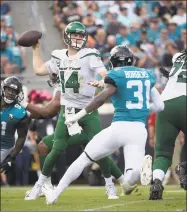  ?? Phelan M. Ebenhack / Associated Press ?? Qquarterba­ck Sam Darnold and the Jets will take on the Dolphins today in Miami.