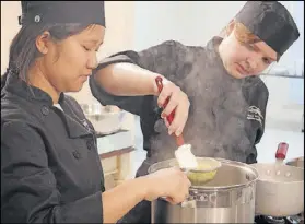  ?? KENNESAW STATE UNIVERSITY ?? Students prepare a dish for their pop-up restaurant class at Kennesaw State University, a capstone course that signals the students are nearing the end of their work on their culinary sustainabi­lity and hospitalit­y degrees.