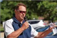  ?? MARIAN DENNIS – DIGITAL FIRST MEDIA ?? Rob Kurtz, who donated a newly landscaped area outside Keystone Villa in Douglassvi­lle, thanks veterans for their service and talks about what the sitting area beneath the flagpole represents.