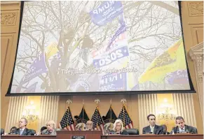  ?? REUTERS ?? An image of a man in a tree identified by police at the time as being armed with a gun is displayed above committee members investigat­ing the Jan 6 Capitol riot in Washington on Tuesday.