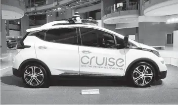  ?? PAUL SANCYA AP ?? The Cruise is both self-driving and electric. They are Chevrolet Bolt cars outfitted with driverless sensors.