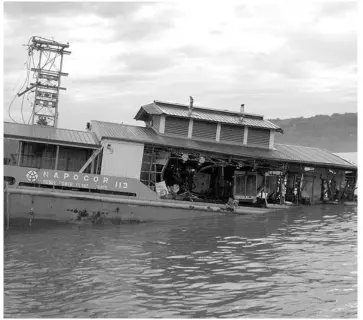  ?? PHOTO HANDOUT ?? A NAPOCOR power barge servicing the island-province of Siquijor was damaged by super-typhoon Pablo.
