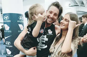  ??  ?? Thomas celebrates post match with two of his biggest supporters, daughter Matilda and girlfriend Natasha.