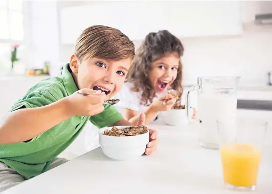  ??  ?? HARD TO STOMACH: Moody schoolchil­dren sometimes make a meal out of eating breakfast, testing the patience of many parents.