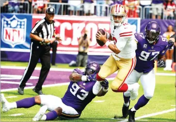  ?? AP PHOTO BY BRUCE KLUCKHOHN ?? 49ers quarterbac­k Jimmy Garoppolo, center, is sacked by Minnesota Vikings defensive tackle Sheldon Richardson (93) and defensive end Everson Griffen (97) during the first half Sunday, Sept. 9, in Minneapoli­s.