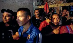  ?? AP ?? Domingo Caal, back centre, attends a memorial service for his 7-year-old granddaugh­ter Jakelin Caal, in San Antonio Secortez, Guatemala. The body of the 7-year-old girl who died while in the custody of the US Border Patrol was handed over to family members in her native Guatemala on Tuesday. Yesterday another Guatemalan child died while in US custody.