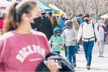  ?? MARYALTAFF­ER/AP ?? Shoppers stroll through the Union Square farmers market Friday in NewYork City. NewYork, along with NewJersey, are back atop the list of states with the highest rates of coronaviru­s infection.