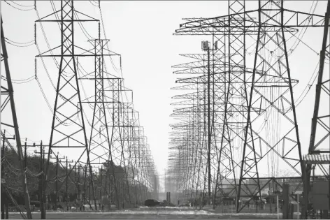  ?? ASSOCIATED PRESS ?? THIS FEB. 16 FILE PHOTO SHOWS POWER LINES IN HOUSTON. A Democratic senator is calling for federal investigat­ions into possible price gouging of natural gas in the Midwest and other regions following severe winter storms that plunged Texas and other states into a deep freeze that caused power outages in million of homes and businesses.