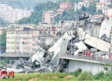  ??  ?? The collapsed Morandi Bridge is seen in the Italian port city of Genoa, Italy. — Reuters photos