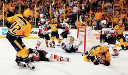  ??  ?? NASHVILLE: Ryan Johansen #92 of the Nashville Predators shoots the puck against John Gibson #36 of the Anaheim Ducks during the third period in Game Three of the Western Conference Final during the 2017 Stanley Cup Playoffs at Bridgeston­e Arena. —AFP