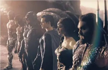  ?? HBO MAX ?? Ray Fisher, from left, Ezra Miller, Ben Affleck, Henry Cavill, Gal Gadot and Jason Momoa show off their Halloween costumes in “Zack Snyder’s Justice League,” streaming March 18 on HBO Max.