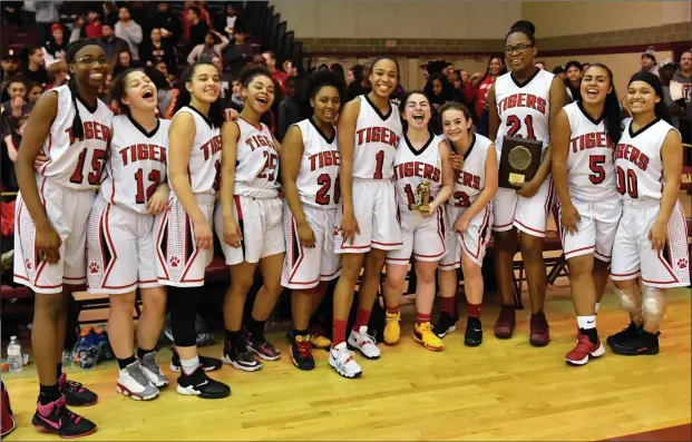  ?? Photo by Jerry Silberman / risportsph­oto.com ?? For the second time in four seasons, the Tolman girls basketball team claimed the Division III title at the Murray Center. Sunday, senior forward Tamara Negron (3) scored a game-high nine points, while senior guard and the game’s MVP, Julia Al-Amir (10), hit two three 3-pointers and finished with seven.