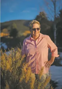  ?? MORGAN TIMMS/Taos News ?? Artist Kari Bell stands for a portrait on Thursday (Jan. 7) outside her home in Taos.