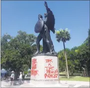  ?? PHILIP WEISS/ASSOCIATED PRESS ?? A statue that memorializ­es the Confederac­y was vandalized in Charleston, South Carolina, days after a mass killing.