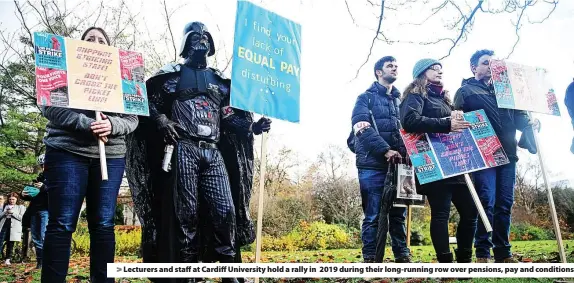  ?? ?? > Lecturers and staff at Cardiff University hold a rally in 2019 during their long-running row over pensions, pay and conditions