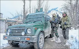  ?? AFP ?? ■ Security personnel stand guard near the site of the encounter in Khrew area of Pampore in Pulwama district on Tuesday.