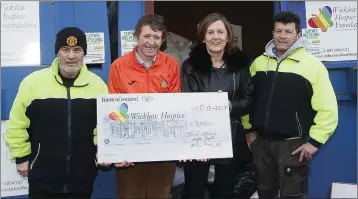  ??  ?? Myles Doyle and Andrew Kinsella from Avoca Recycling Centre present a cheque for €3,020 to Bill Porter and Evanne Cahill from the Wicklow Hospice Foundation.