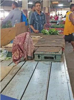  ?? Photo: Nicolette Chambers ?? Virendra Singh shows his table with only three bundles of Chinese cabbage to sell at the Lautoka Municipal Market on January 6, 2023.