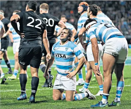  ??  ?? On their knees: Nicolas Sanchez of Argentina cannot hide his disappoint­ment during the Rugby Championsh­ip defeat to New Zealand