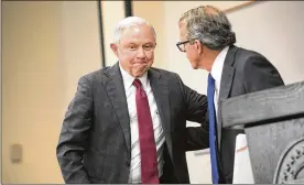  ?? MADDIE MCGARVEY / GETTY IMAGES ?? U.S. Attorney General Jeff Sessions hugs Ohio Attorney General Mike DeWine before speaking in Columbus on the opioid epidemic.