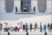  ?? J. SCOTT APPLEWHITE — THE ASSOCIATED PRESS ?? People pay their respects as Justice Ruth Bader Ginsburg lies in repose under the Portico at the top of the front steps of the U.S. Supreme Court building in Washington on Wednesday. Ginsburg, 87, died of cancer on Sept. 18.
