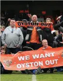  ??  ?? Blackpool supporters invade the pitch and take part in a protest against the club owners