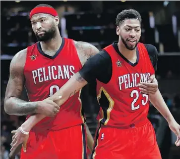  ?? Streeter Lecka Getty Images ?? DeMARCUS COUSINS, left, and Anthony Davis played together in New Orleans and would have been a formidable frontcourt this season. But Cousins tore a knee ligament, forcing the Lakers to rethink options.