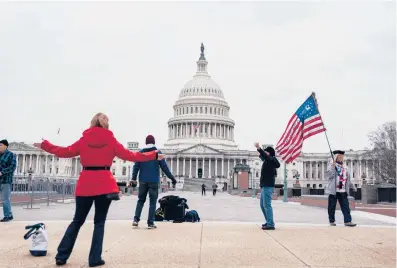  ?? ANNA MONEYMAKER/THE NEW YORK TIMES ?? Supporters of President Donald Trump gather outside the U.S. Capitol on Monday.