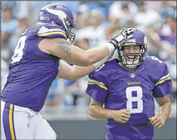  ?? AP ?? Sam Bradford (8) has received a warm welcome in Minnesota, where his efficient play has the Vikings rolling along as the league’s only remaining unbeaten team.