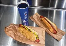  ?? ANGELINE WOO/LOS ANGELES TIMES/TNS ?? Two hot dog combos at the indoor food court at the Costco location in Van Nuys, Los Angeles.