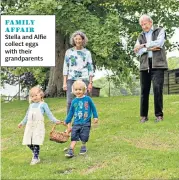 ??  ?? FAMILY AFFAIR Stella and Alfie collect eggs with their grandparen­ts