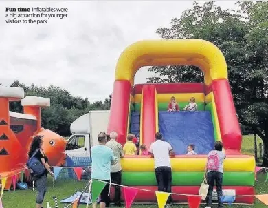  ??  ?? Fun time Inflatable­s were a big attraction for younger visitors to the park