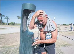  ?? REUTERS ?? A man cools down by the bank of the Rio de la Plata during a heat wave in Buenos Aires on Saturday.