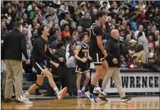  ?? PHOTO BY AMANDA SABGA — MEDIANEWS GROUP/BOSTON HERALD ?? Newton North teammates celebrate a play against Lawrence during state tournament play Friday in Lawrence. Before a large crowd, Newton North won, 55-54.