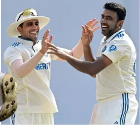  ?? GETTY IMAGES ?? High fives: Ashwin and Gill celebrate Crawley’s wicket