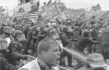  ?? IMAGES ?? Supporters of President Donald clash with police and security forces as people try to storm the U.S. Capitol on Jan. 6.