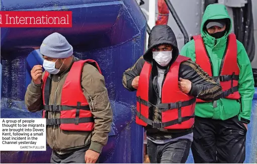  ?? ?? A group of people thought to be migrants are brought into Dover, Kent, following a small boat incident in the Channel yesterday
GARETH FULLER