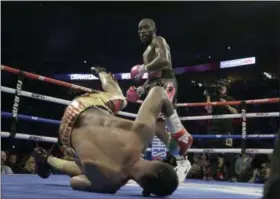  ?? NATI HARNIK - THE ASSOCIATED PRESS ?? Terence Crawford watches as Jose Benavidez goes down in the 12th round during their WBO welterweig­ht title boxing bout in Omaha, Neb., Saturday, Oct. 13, 2018. Terence Crawford won in the 12th round.