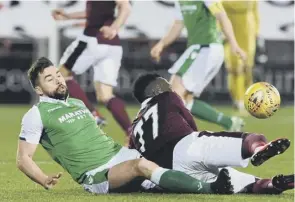  ??  ?? Darren Mcgregor and Esmael Goncalves clash in an often feisty derby.