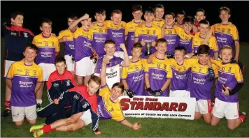  ??  ?? St. Mary’s (Maudlintow­n) celebrate their New Ross Standard Under-14 football championsh­ip win.