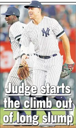  ?? Paul J. Bereswill ?? HAPPY DAYS: Aaron Judge, who went 2-for-3 with two runs scored and a walk, is all smiles while celebratin­g with Didi Gregorius after the Yankees’ 3-2 victory over the Indians.