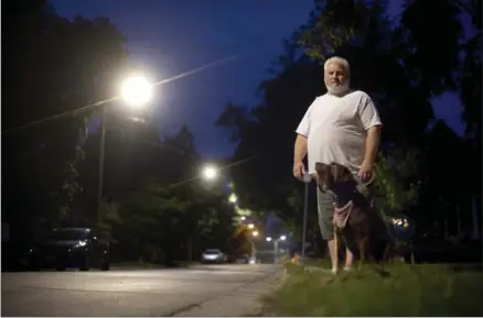  ?? MATHEW MCCARTHY, RECORD STAFF ?? Rob Stephens says the new LED street lights in front of his home on Louisa Street in Kitchener are too bright.