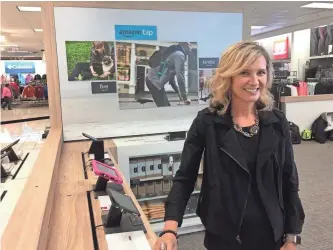  ?? RICK ROMELL / MILWAUKEE JOURNAL SENTINEL ?? Michelle Gass, Kohl’s Corp. chief merchandis­ing and customer officer, shows off the new Amazon “smart home” department at the Kohl’s store in Chicago’s Bucktown neighborho­od northwest of the Loop.