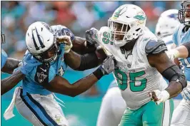  ?? JEFF HAYNES / AP ?? Dolphins defensive end William Hayes, acquired in March from the Rams, is rated as the fifth-best run-defending edge rusher in the NFL by Pro Football Focus.