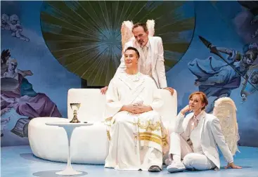  ?? Lynn Lane ?? The Alley Theatre’s “An Act of God,” starring Todd Waite, center, as God, John Feltch as Gabriel and Emily Trask as Michael, tackles several prickly issues, among them the Almighty’s stance on homosexual­ity.