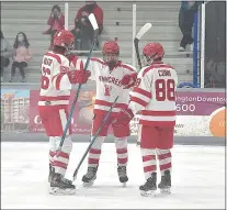  ?? PETE BANNAN — MEDIANEWS GROUP ?? Penncrest players, from left, Kain Walker, Ryan Anderson and Tyler Conn celebrate Anderson’s goal in the first period of the Flyers Cup Class A first round Monday night at IceWorks. Penncrest beat Plymouth Whitemarsh, 5-1.