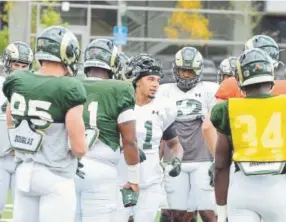  ?? Mike Brohard, Loveland Reporter-Herald ?? Colorado State safety Jordan Fogal (11) works to get his team fired up at the start of practice Monday in Fort Collins.