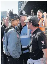  ??  ?? >
The protester who confronted the leader of the English Defence League during the city centre rally at the weekend has been reunited with the Muslim woman she stepped in to protect. Saffiyah Khan (pictured left and above) and Saira Zafar spoke of...